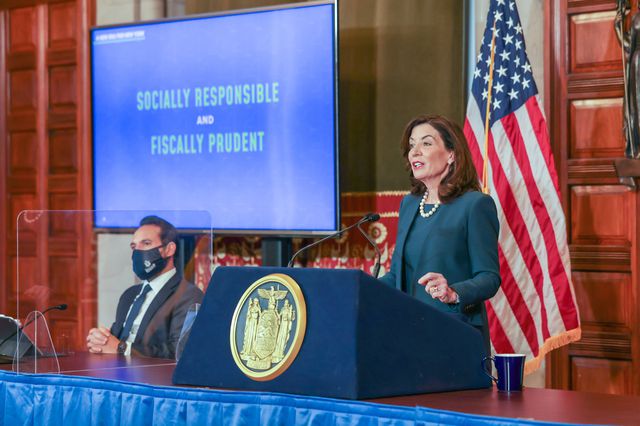 A photo of Gov. Hochul delivering the state budget